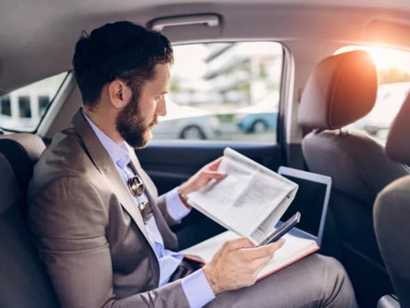 Professional woman in luxury car